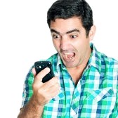 27465116-close-up-of-an-angry-man-yelling-at-his-mobile-phone-isolated-on-white